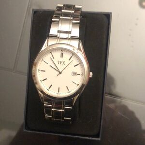 New in box- TFX men’s silver tone watch with white round dial.